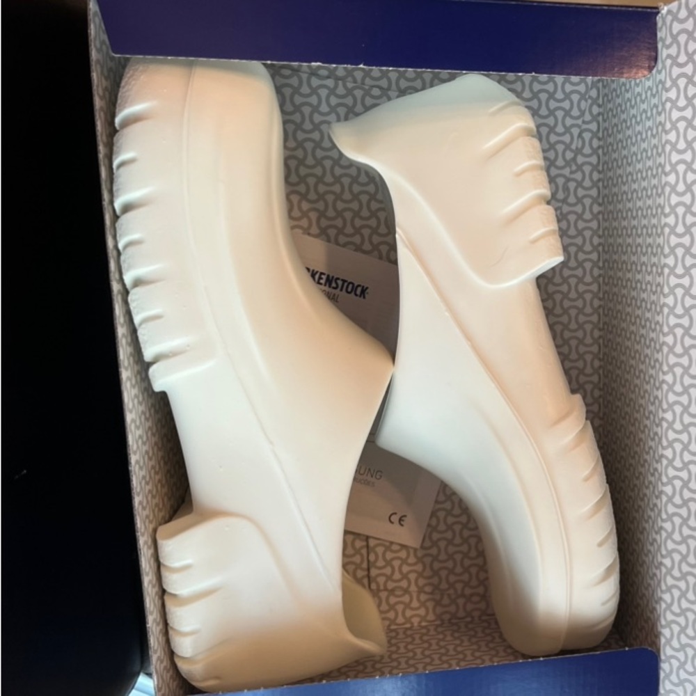 While Birkenstock ,  professional birkis ,  white.  New in box.